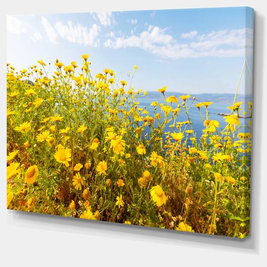 Designart - Little Yellow Flowers over Seashore